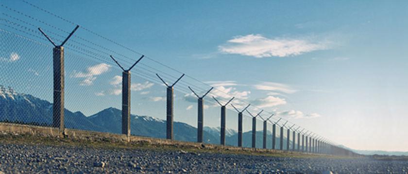 A barbed wire fence. Scientific totoalism sets the dividing line between what it deems scientifc and unscientific.